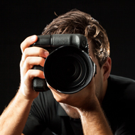 Fotógrafo profesional con cámara, paquete StartUp